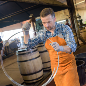 Cooper Making Metal Ring for Oak Wine Barrel