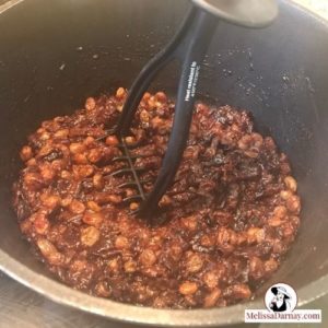 Mashing Cooked Prunes and Raisins